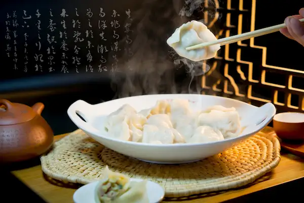 Boiled Dumplings Lifted with Chopsticks